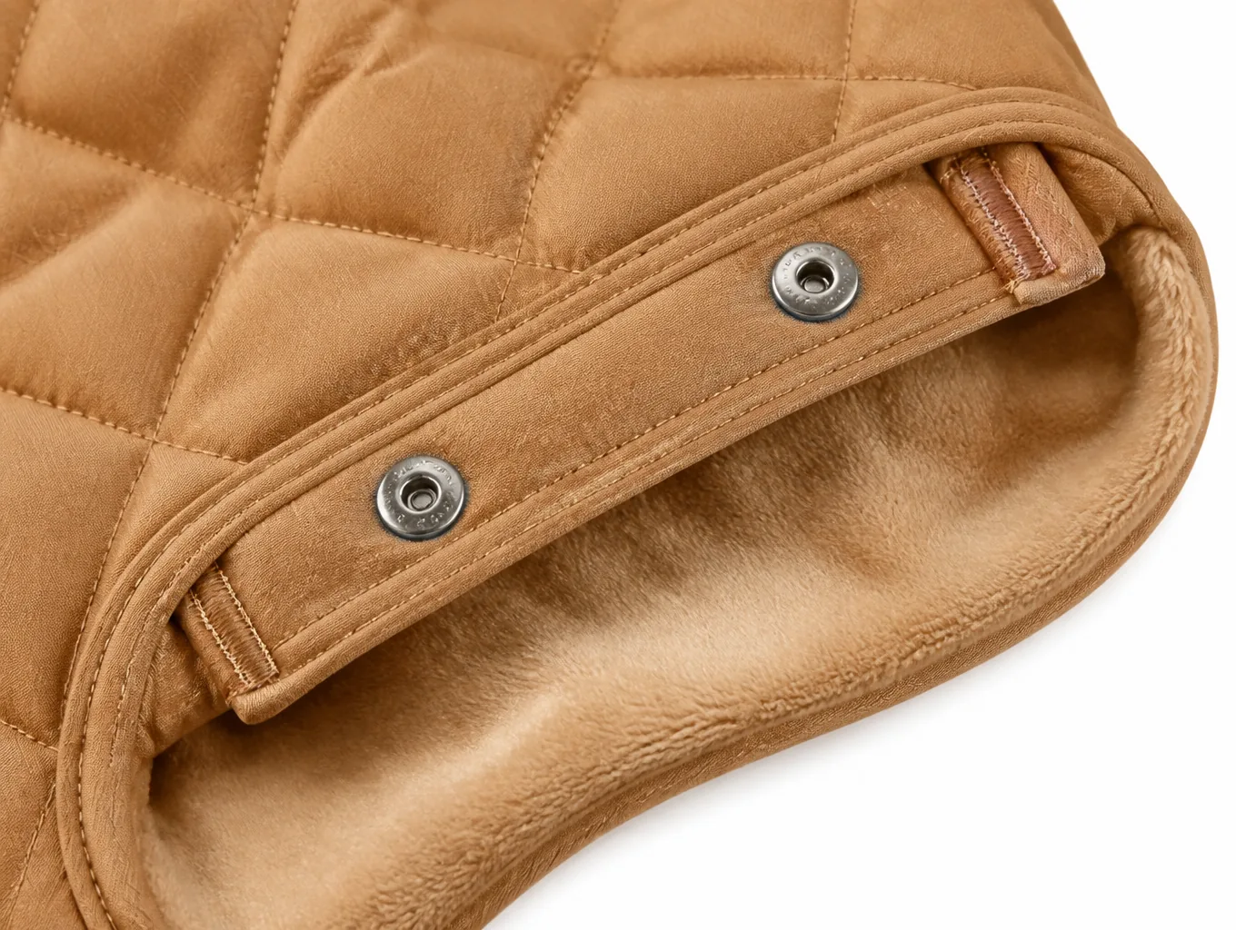 Close-up of the snap-fastened arm opening, bar-tack reinforcement and plush lining