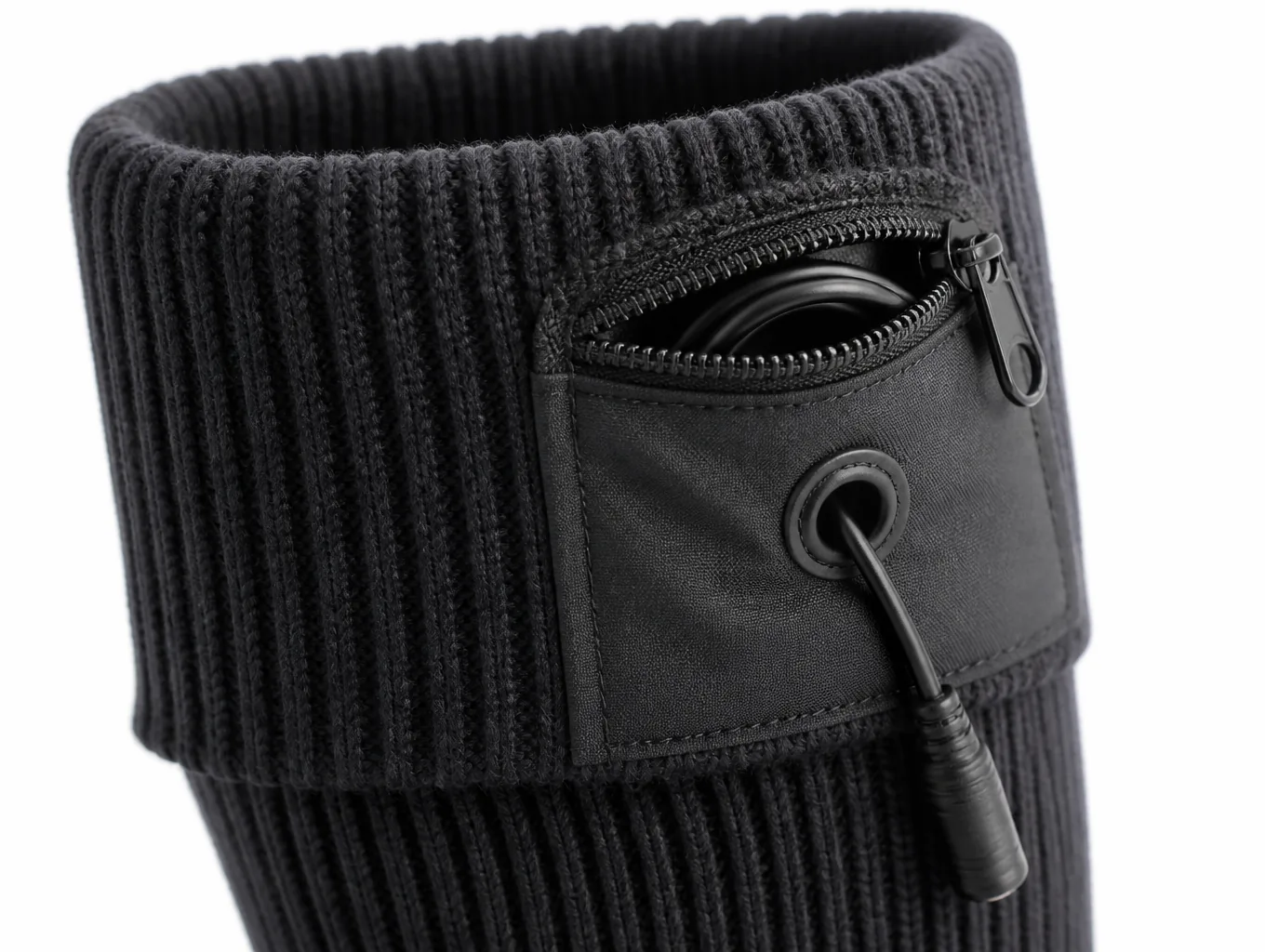 Close-up of the cuff pouch with the zip, the moulded connector and the lead exiting the bound opening