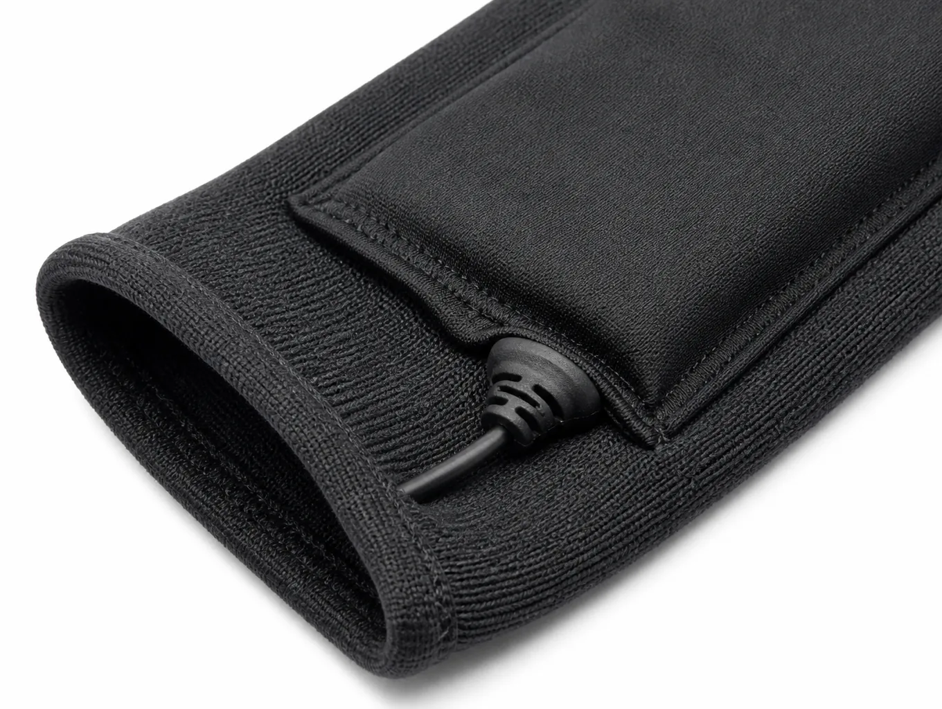 Close-up of the wrist battery pouch, cable boot and bound cuff