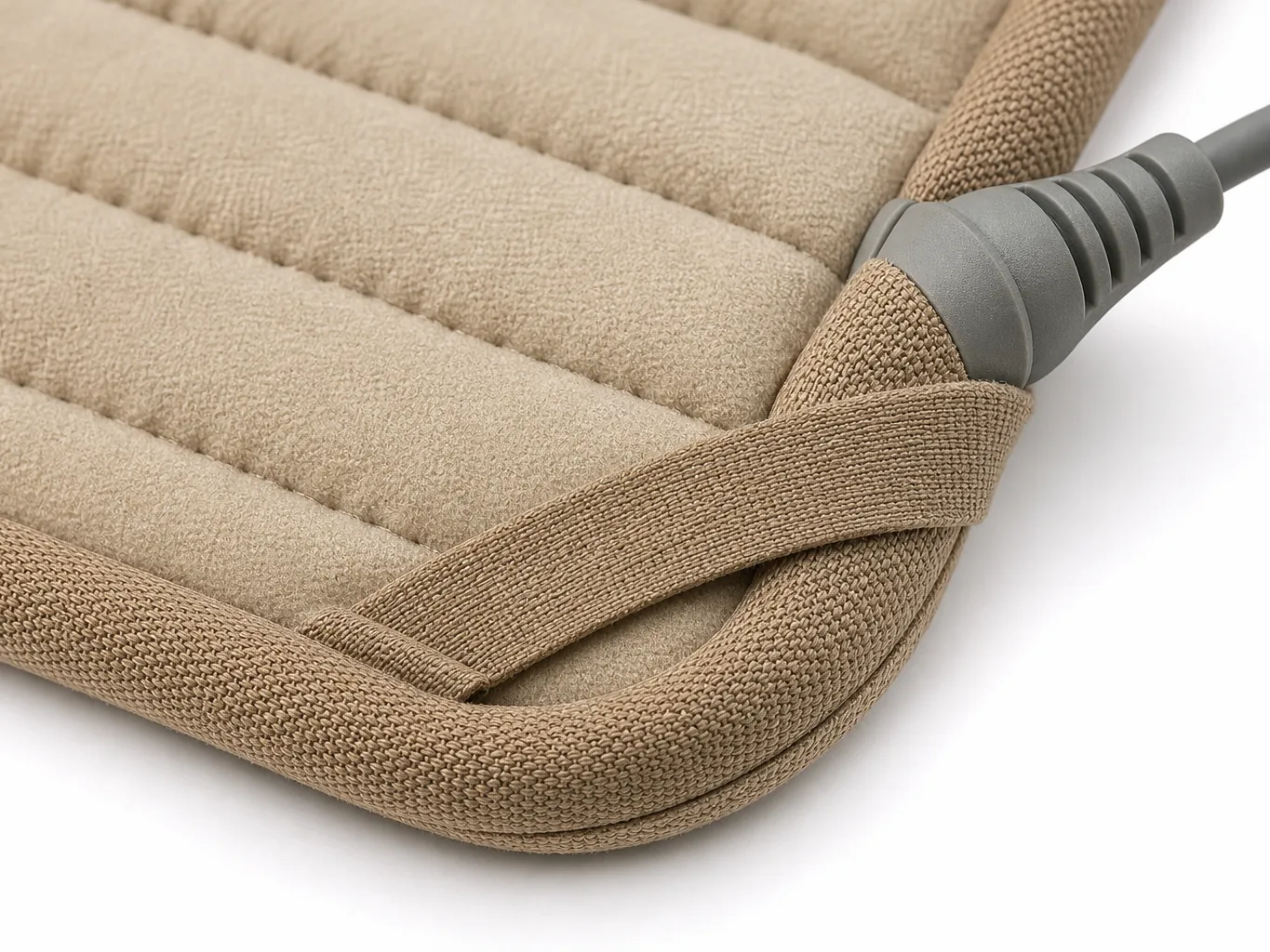 Close-up of the quilted channel pattern, bound corner and moulded strain-relief cord boot