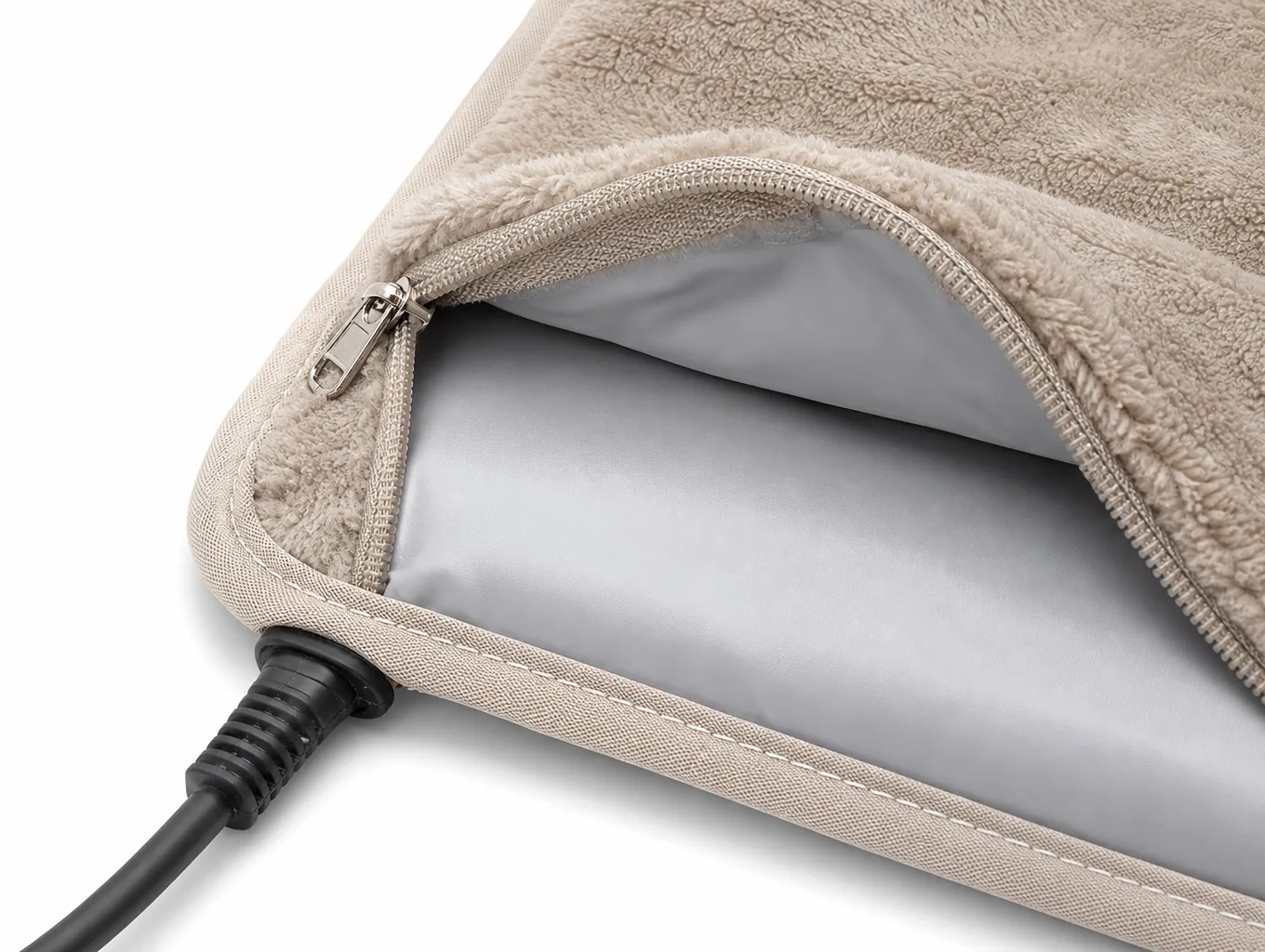 Close-up of the unzipped cover, the sealed waterproof core, the zip and the cord boot